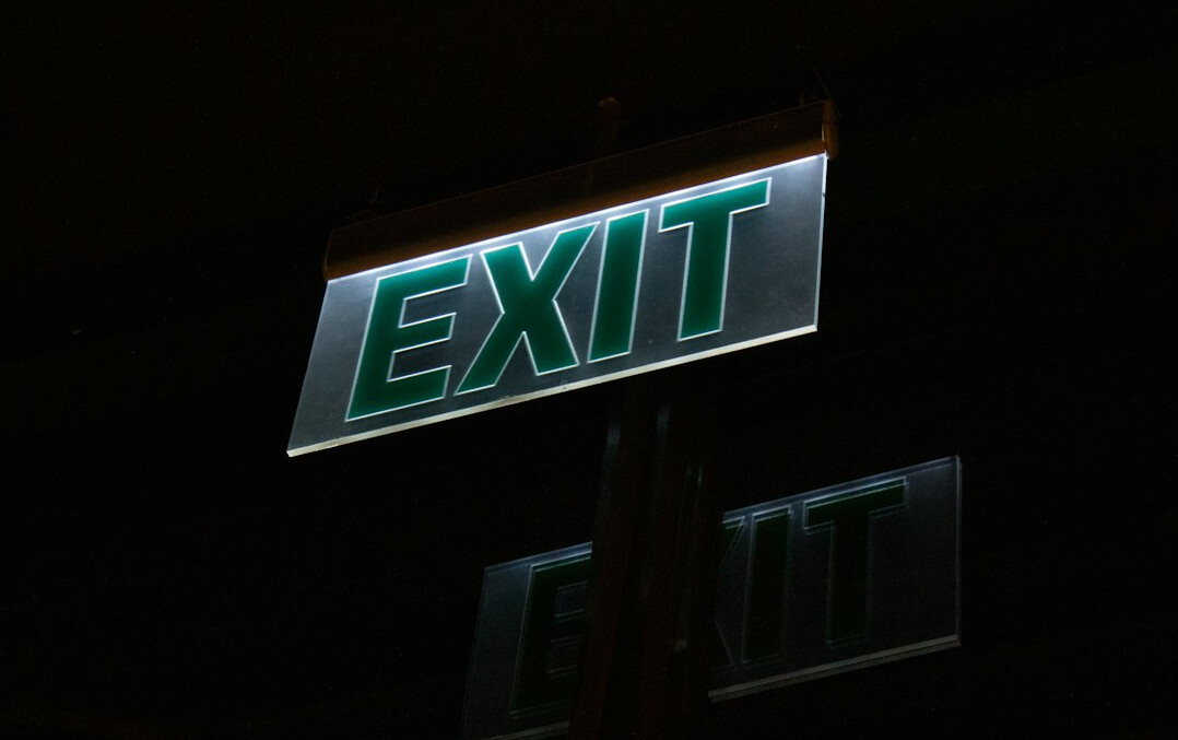 detective arresting shoplifter at exit