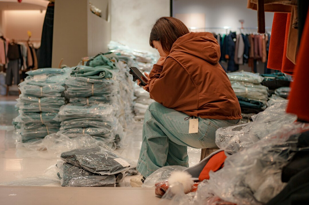 retail employee checking inventory