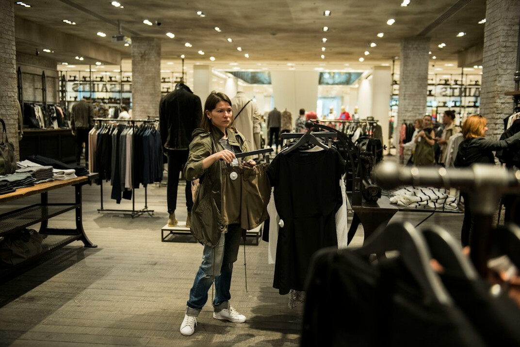 store detective watching shoppers