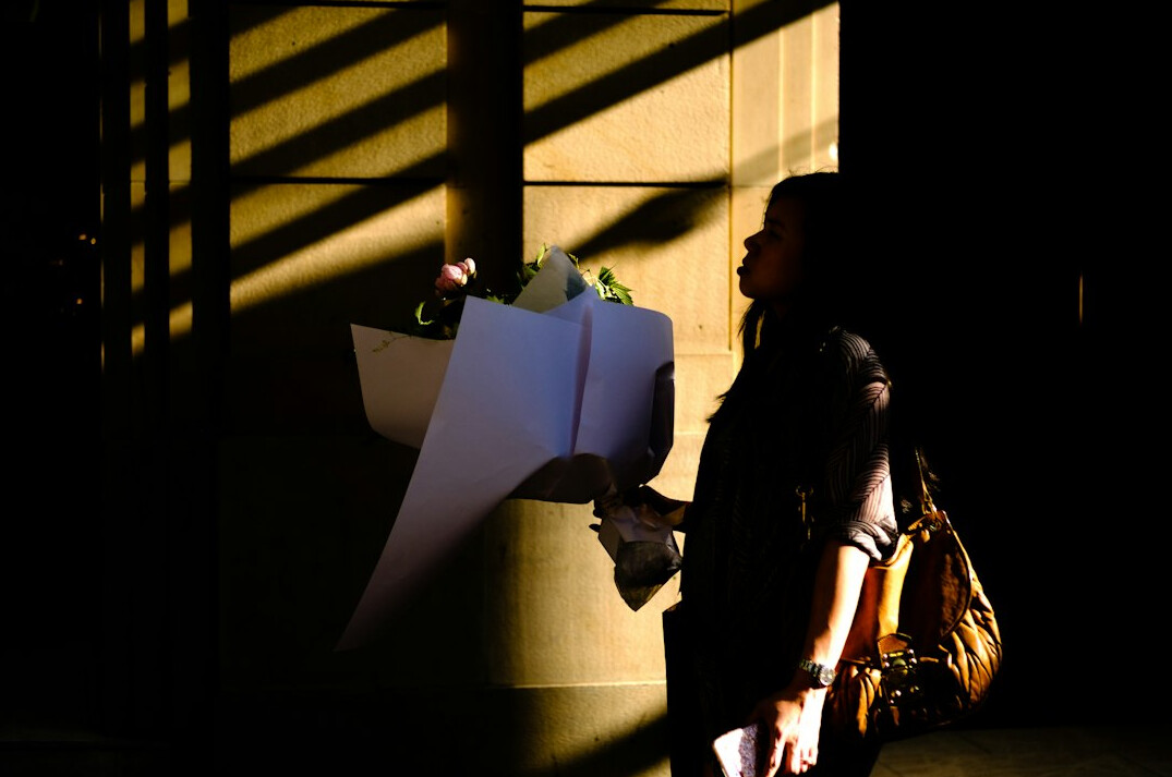 woman hiding items in bag