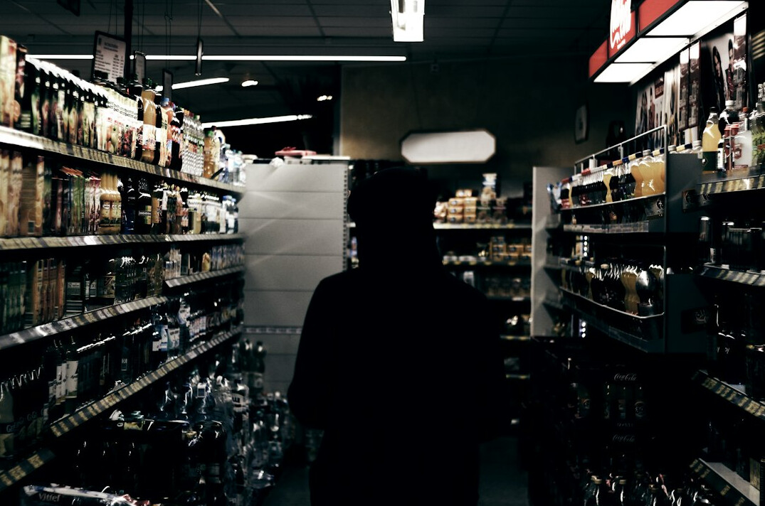 store detective chasing thief